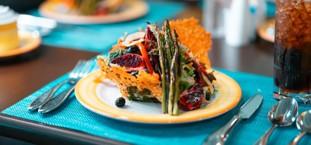 A dynamically arranged plate of food on a dining table