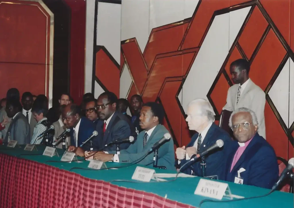 Heads of state, President Carter, and co-facilitator Bishop Desmond Tutu.